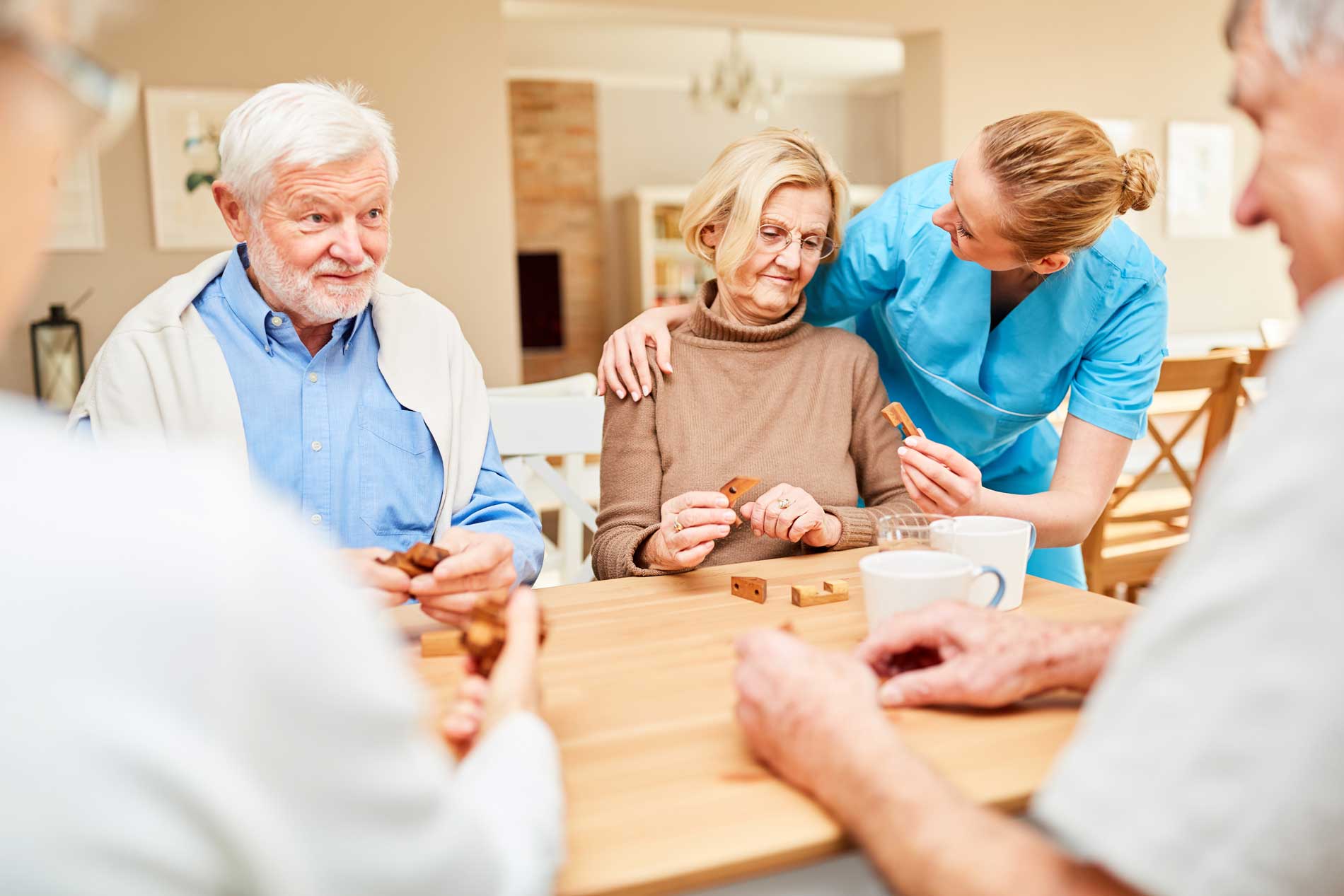 Memory Care Respite Program Support Group Seniors interacting at a table during Memory Care activities