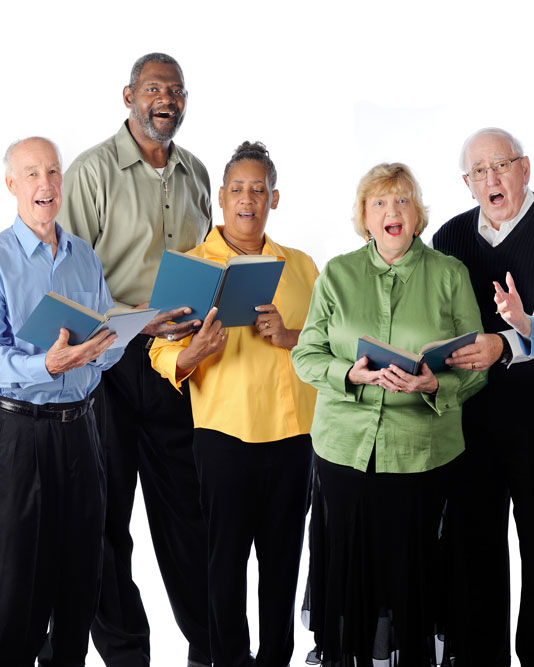 Group of seniors singing music together as a group