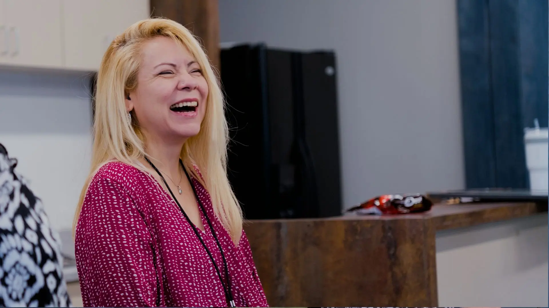 a team member laughing during a support session at the Magnolia Center for Brain Health