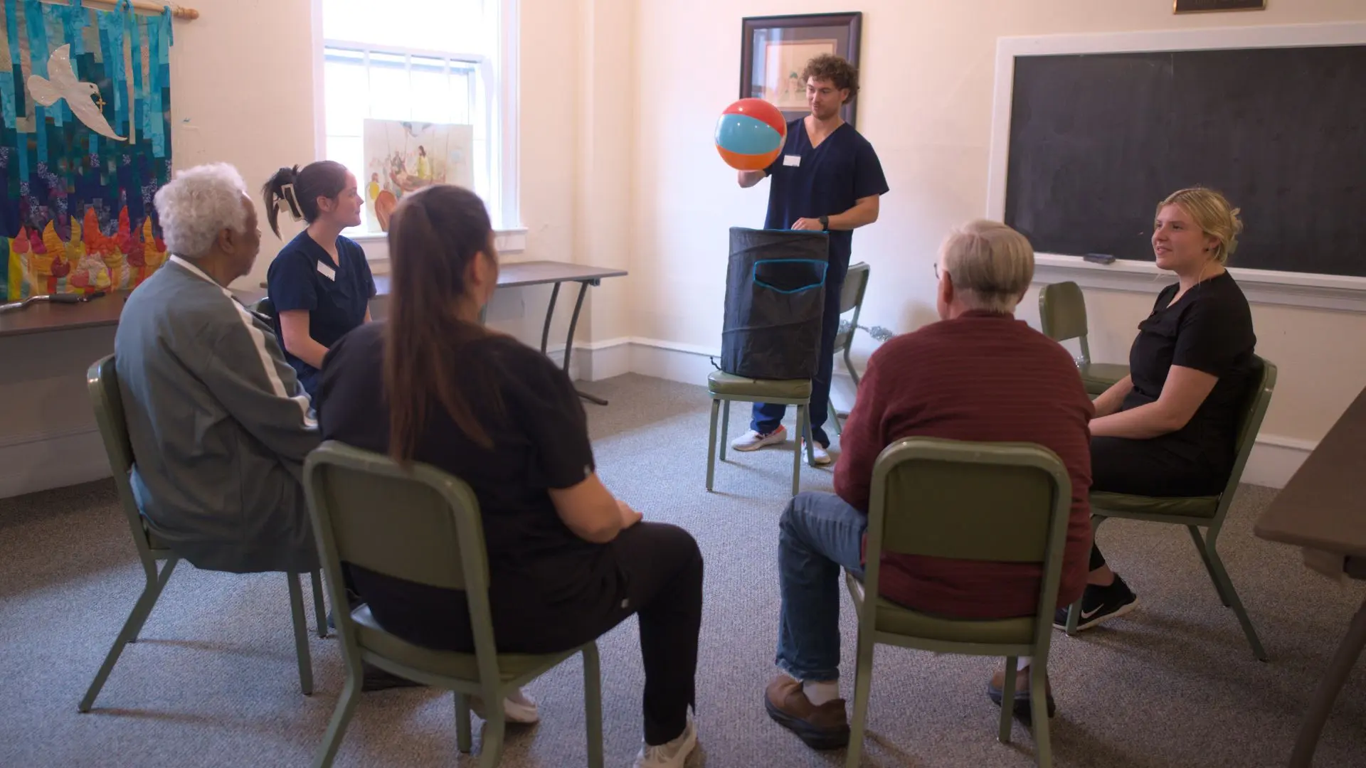 photo of Magnolia Center for Brain Health staff working with participants during during an activities session